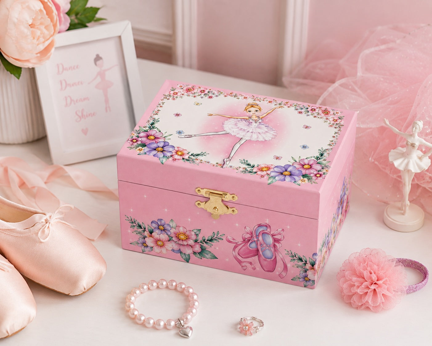 Ballerina musical jewellery box styled with ballet shoes and dance accessories in a ballet-themed bedroom