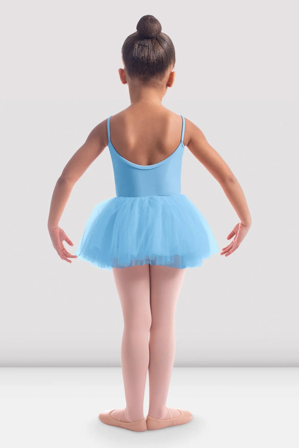 Back view of girl wearing Bloch blue rose embroidered ballet tutu skirt