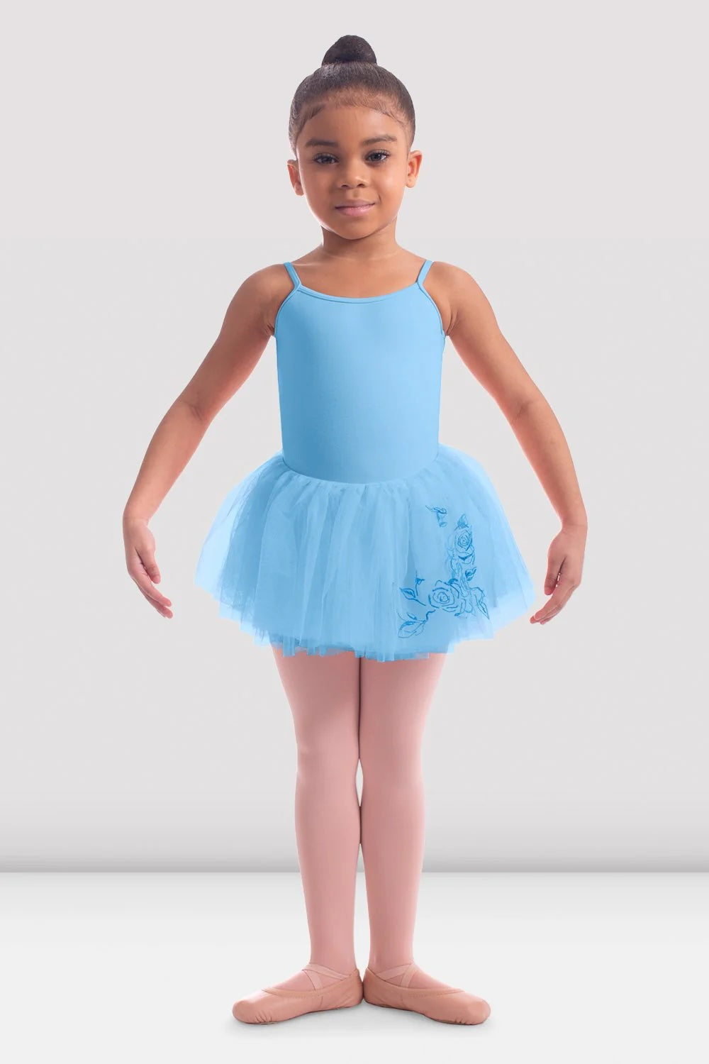 Front view of girl wearing Bloch blue rose embroidered ballet tutu skirt
