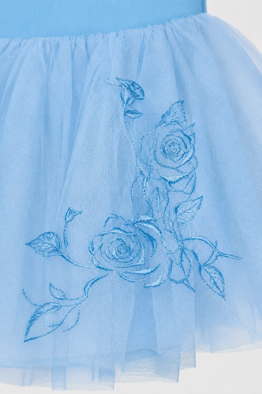 Close-up of blue rose embroidery on Bloch girls ballet tutu skirt
