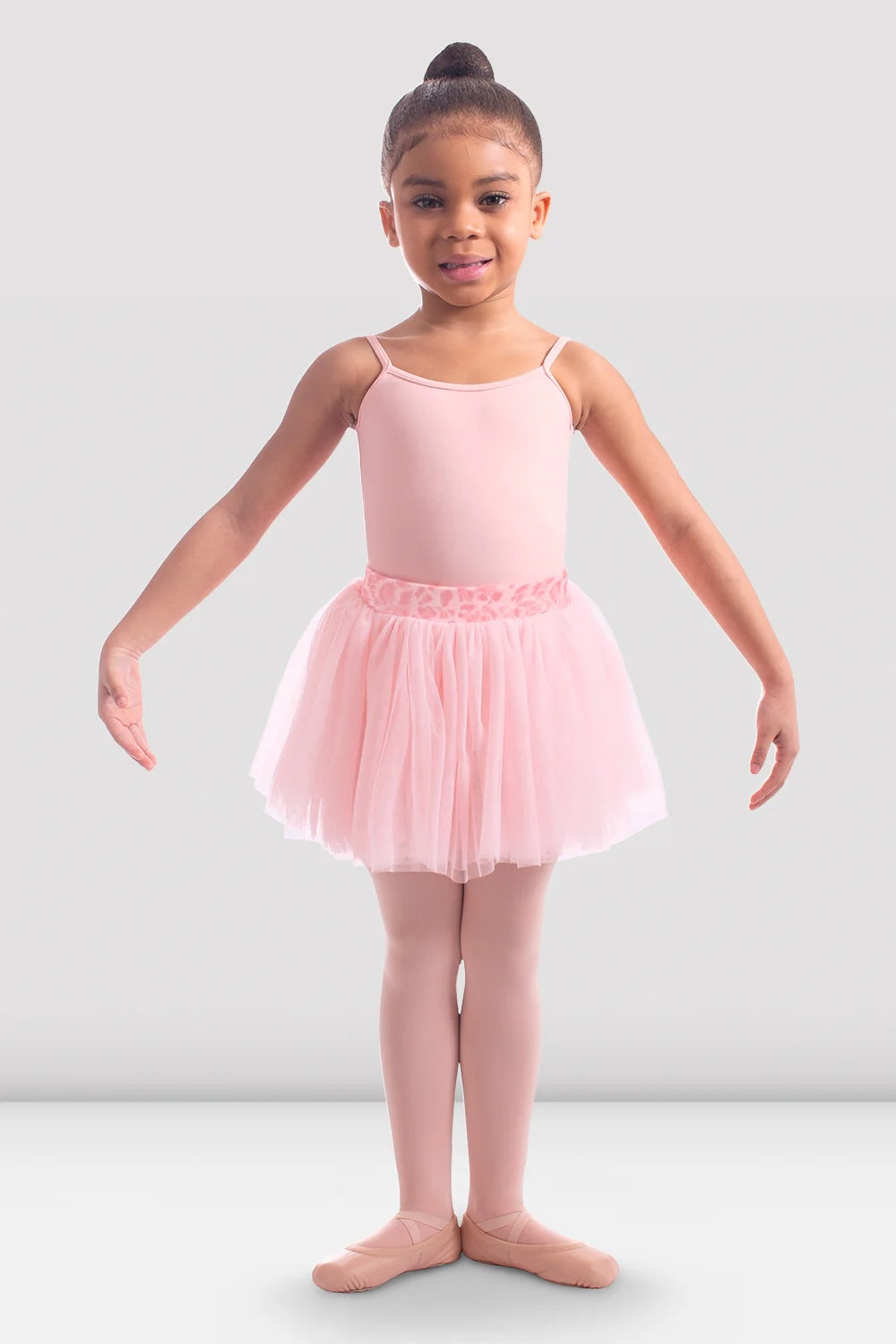 Front view of girl wearing Bloch CR6521 Candy Pink tutu skirt with animal print waistband