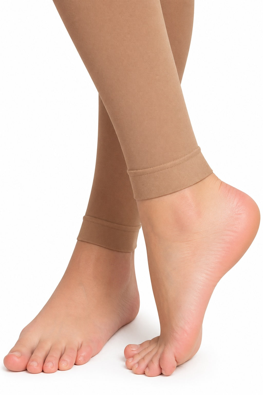 Girls tan footless dance tights by Bloch close-up of ankle and foot opening