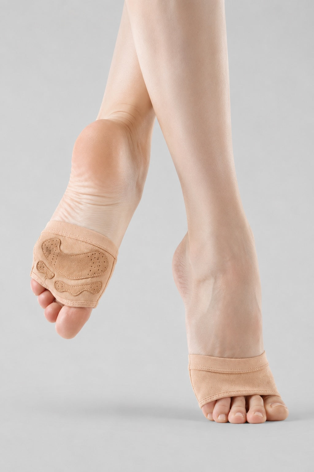 Bloch Orbit stretch canvas foot glove worn on dancer’s feet showing suede grip sole pad