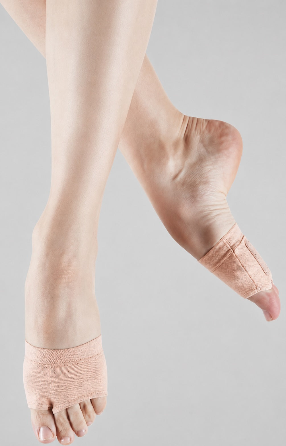 Bloch Orbit stretch canvas foot glove in nude pink on dancer’s feet