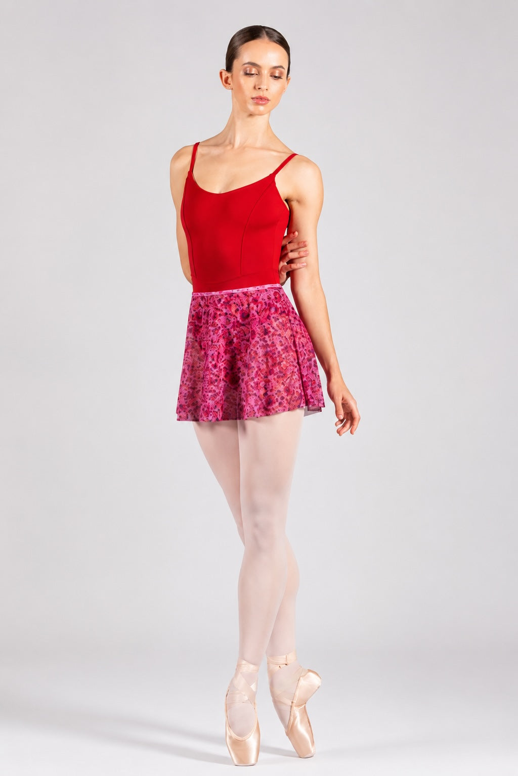 Bloch R0241 Bell Flower floral ballet skirt worn with red leotard front view