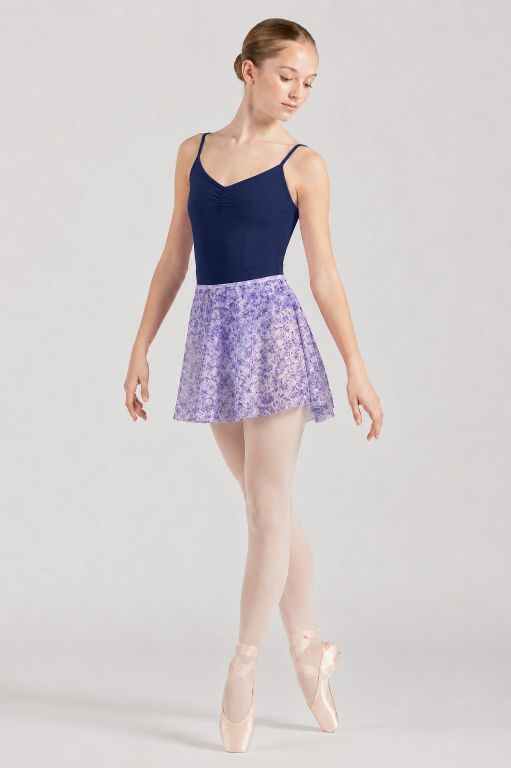Bloch R0241 Lilac Haze floral ballet skirt worn with navy ballet leotard