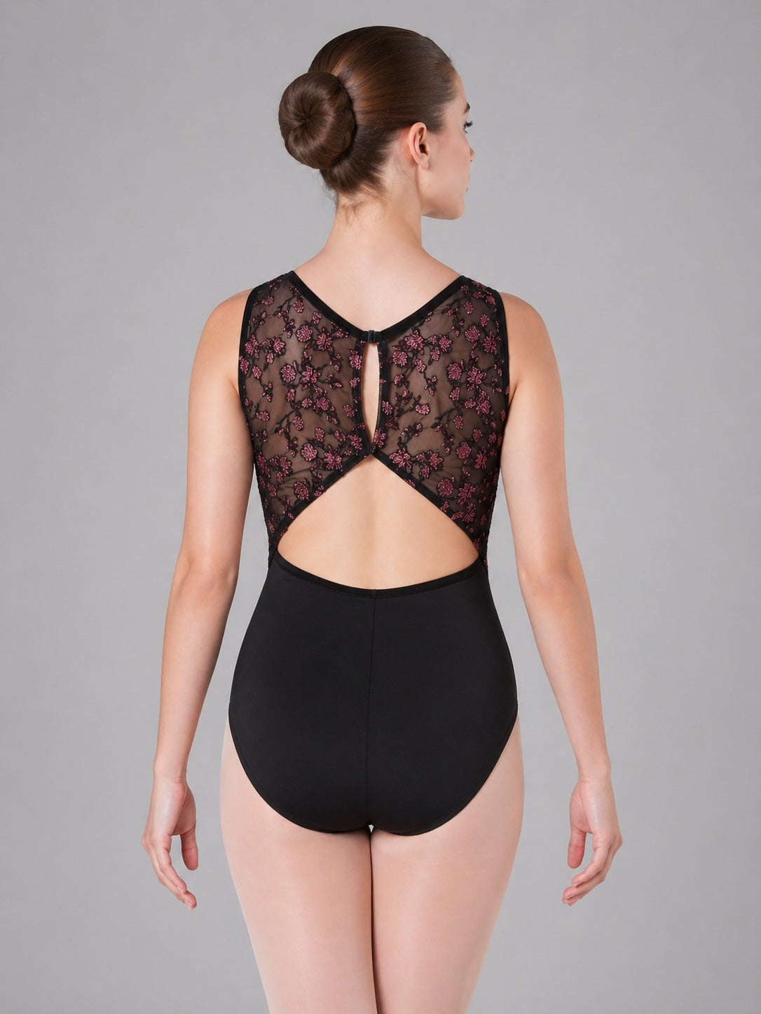 Capezio Allure black ballet leotard with floral mesh back detail, back view on dancer