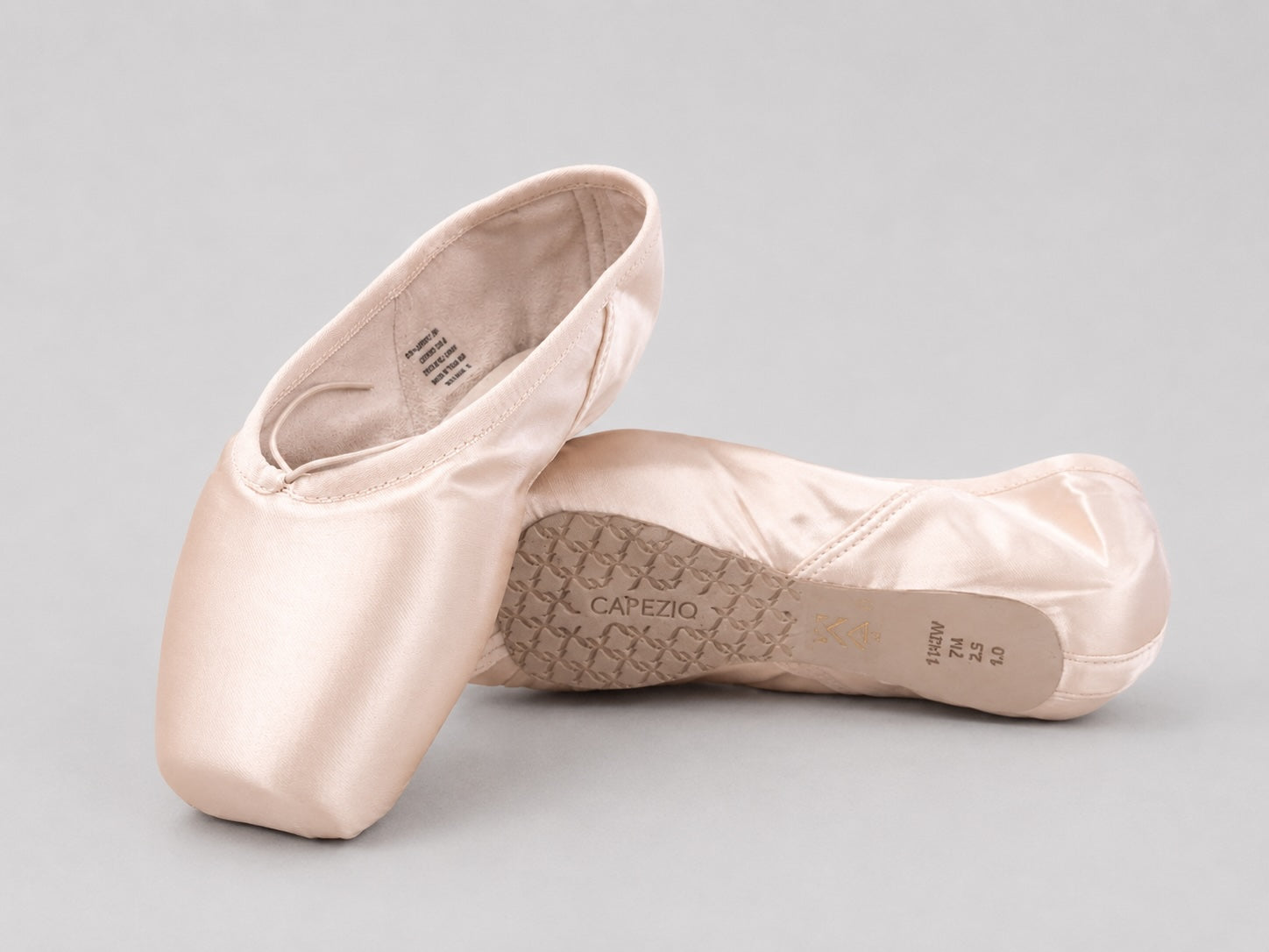 Capezio Ava Pointe Shoes 1141W in petal pink satin showing the broad toe box, side profile and outsole detail