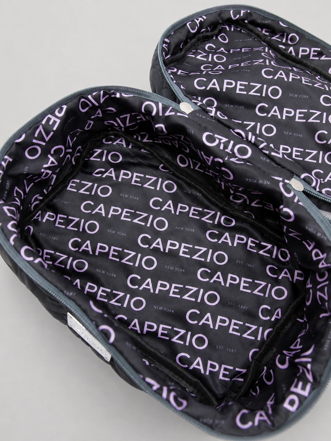 Inside view of Capezio Fleur Vanity Case with branded lining