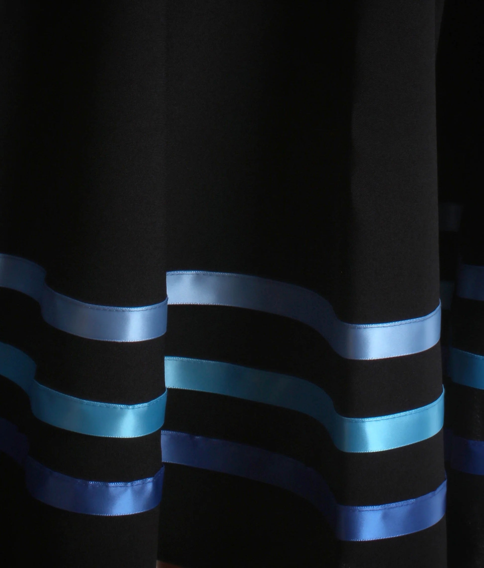 Close-up of ribbon detail on blue RAD & ISTD approved character dance skirt