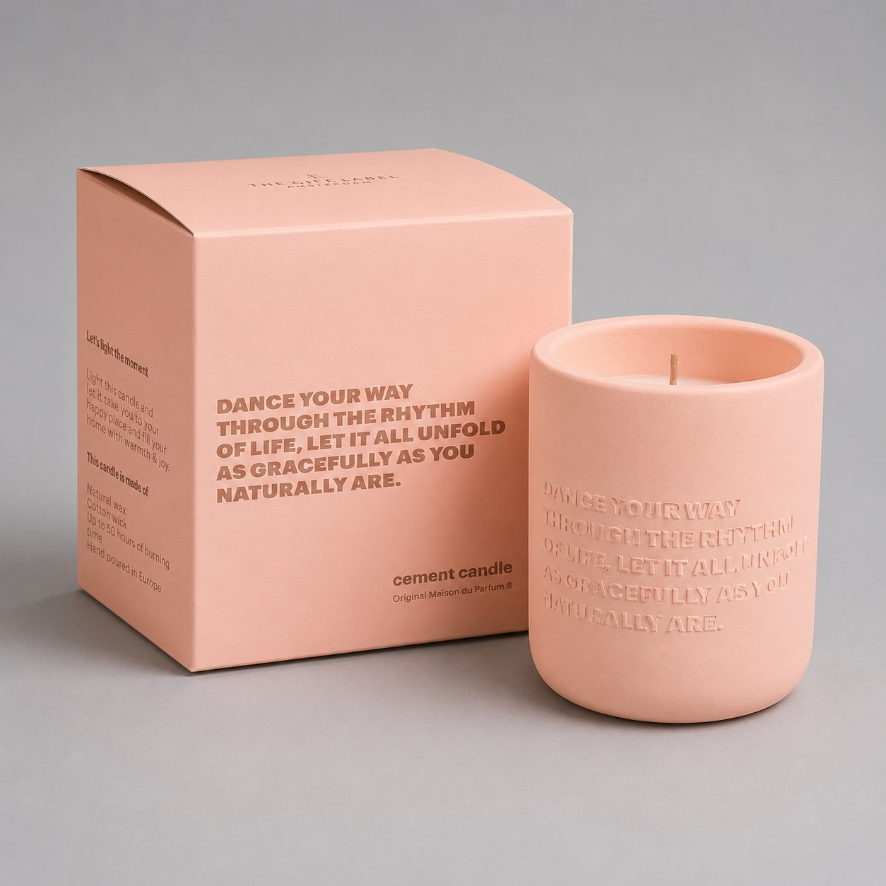 Pink Dance Your Way cement candle with matching gift box on a soft light grey background.