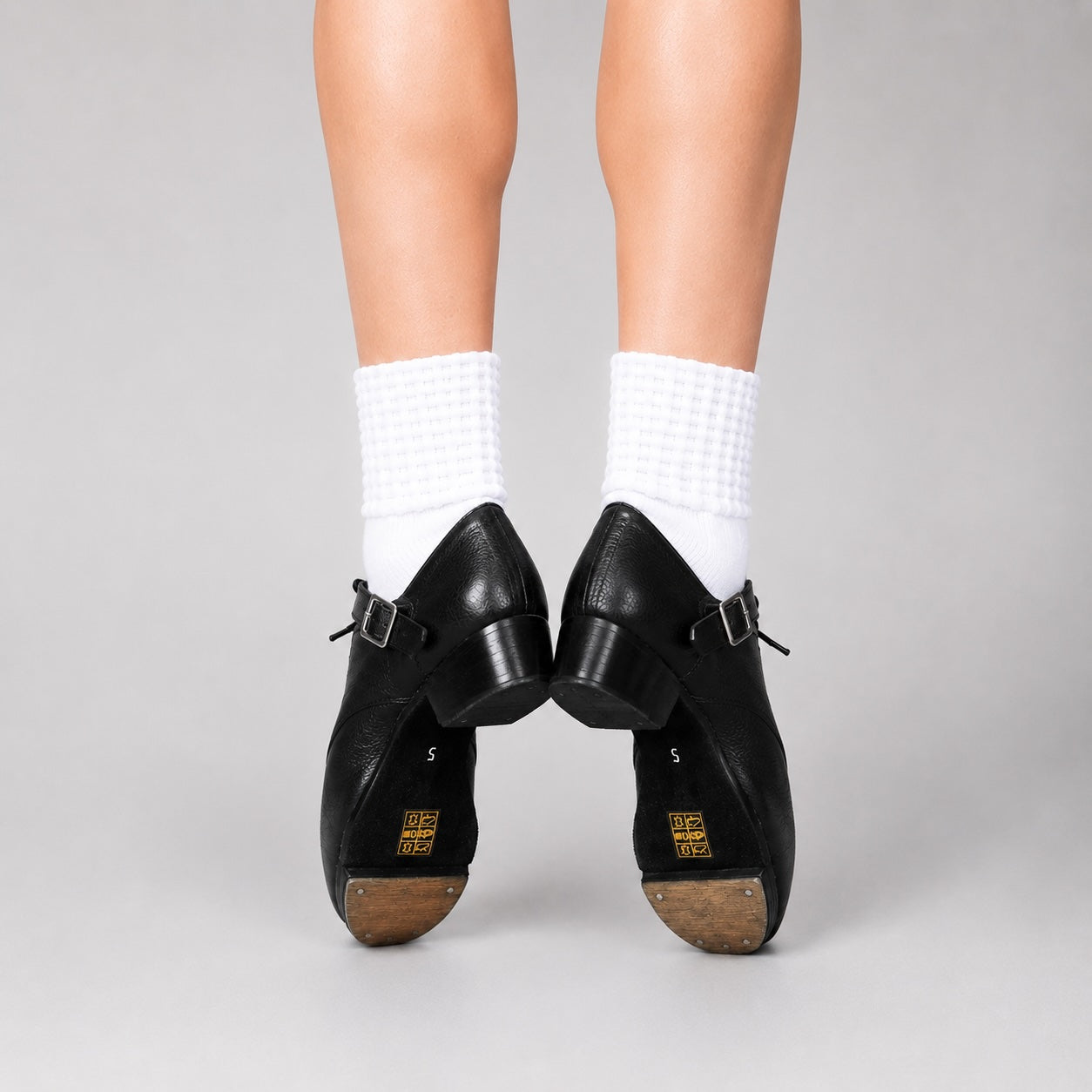 Back heel view of Antonio Pacelli essential beginner jig shoes worn with Irish dance socks