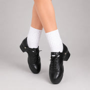 Antonio Pacelli essential beginner jig shoes worn with white Irish dance socks in crossed feet pose