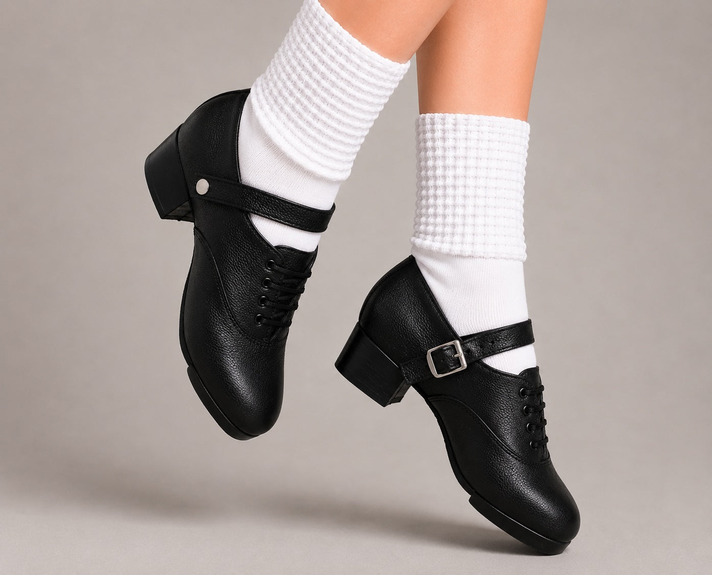 Antonio Pacelli essential beginner jig shoes worn with Irish dance socks in crossed feet pose