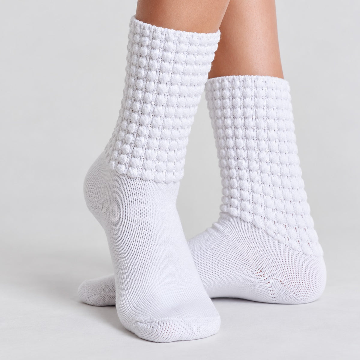 White Feis Sock cotton poodle socks worn by a dancer, showing the textured poodle knit, comfortable fit and traditional Irish dancing style.