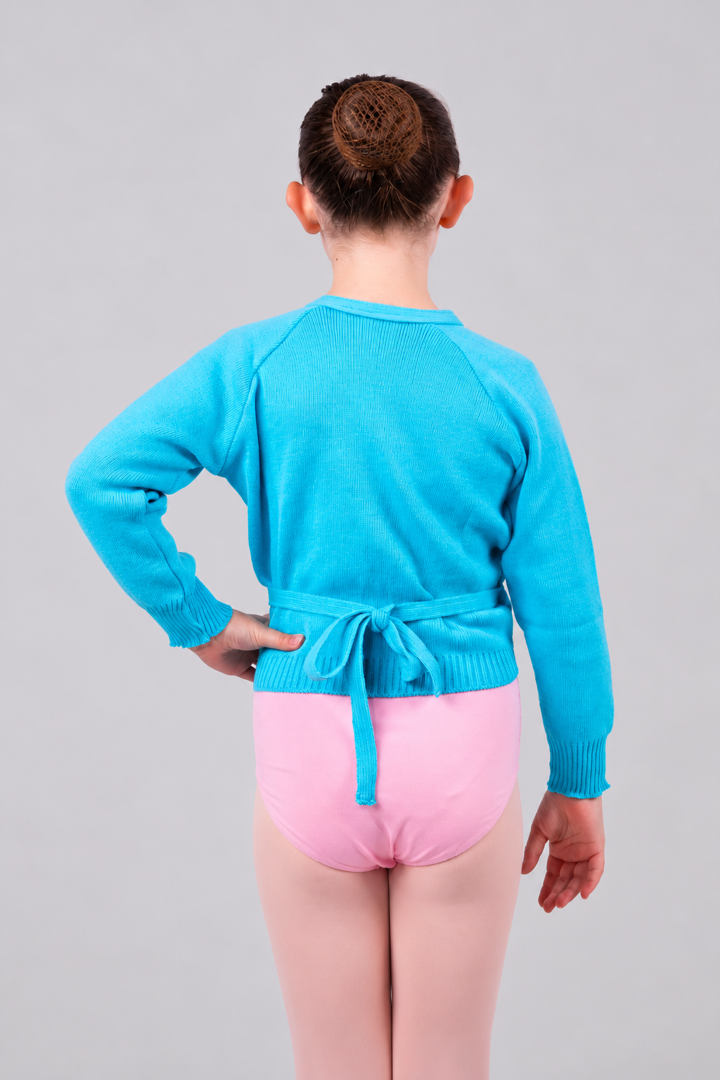 Girls' regulation ballet wrap cardigan in marine blue/teal, back view showing adjustable tie fastening and long sleeves