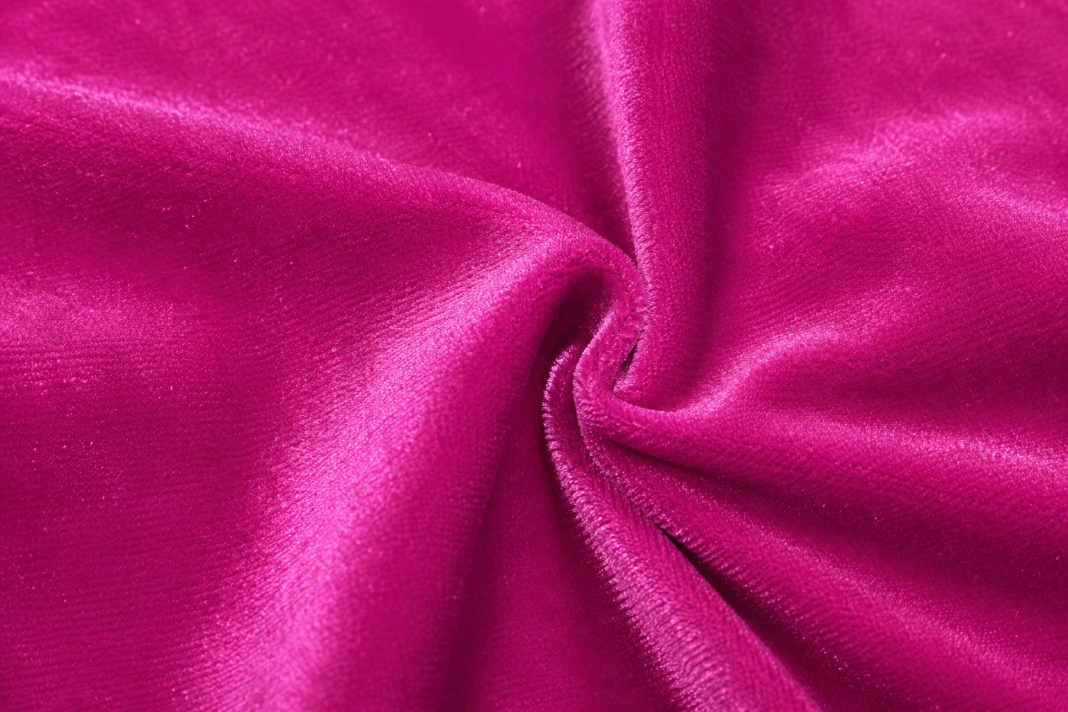 Close-up detail of the pink velour fabric used in the 1st Position Taylor GYM007 girls gymnastics leotard showing its soft texture and subtle sheen on a light grey background