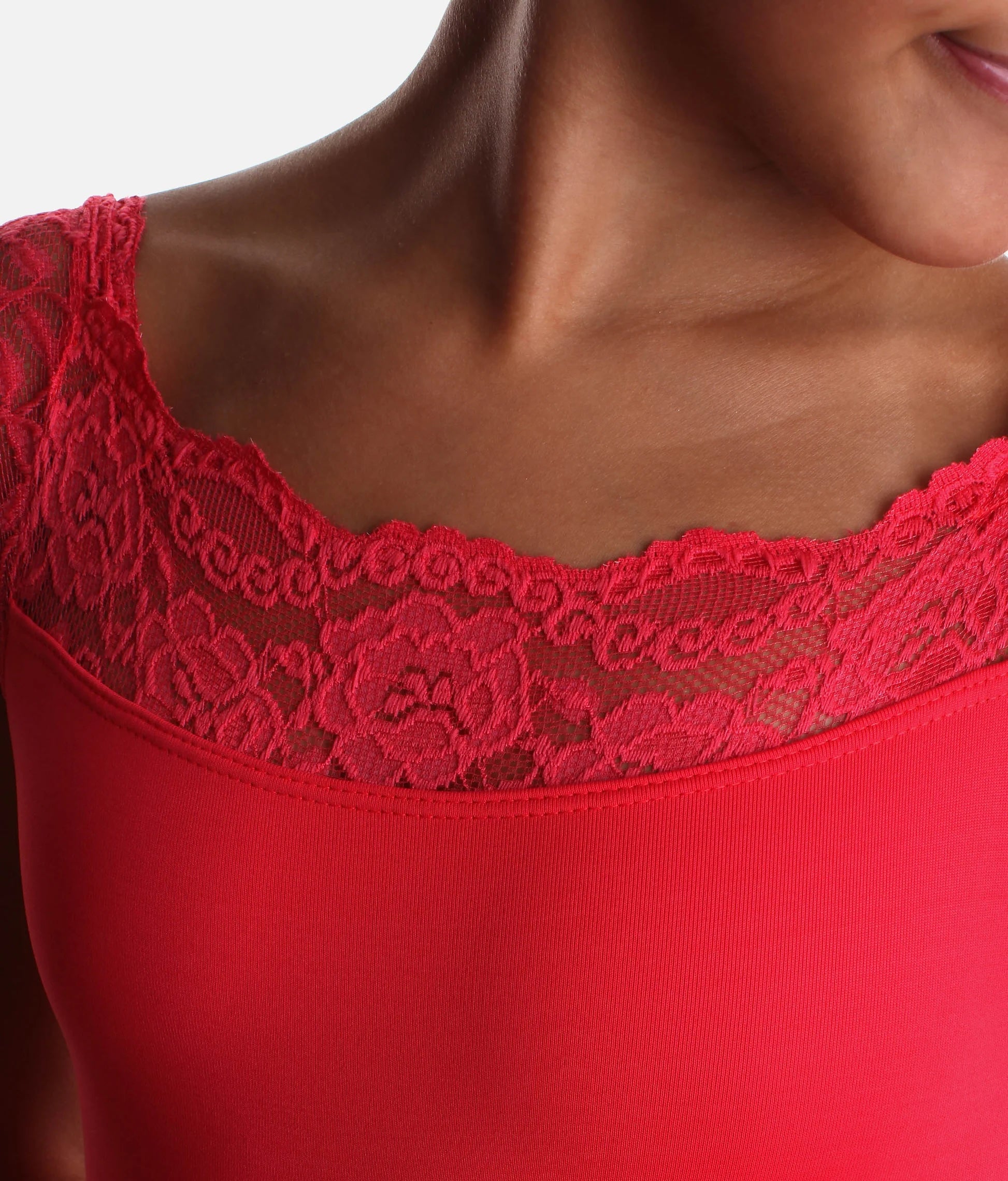 Alt text: Close up of lace neckline and sleeves on geranium lake So Danca SL17 girls leotard