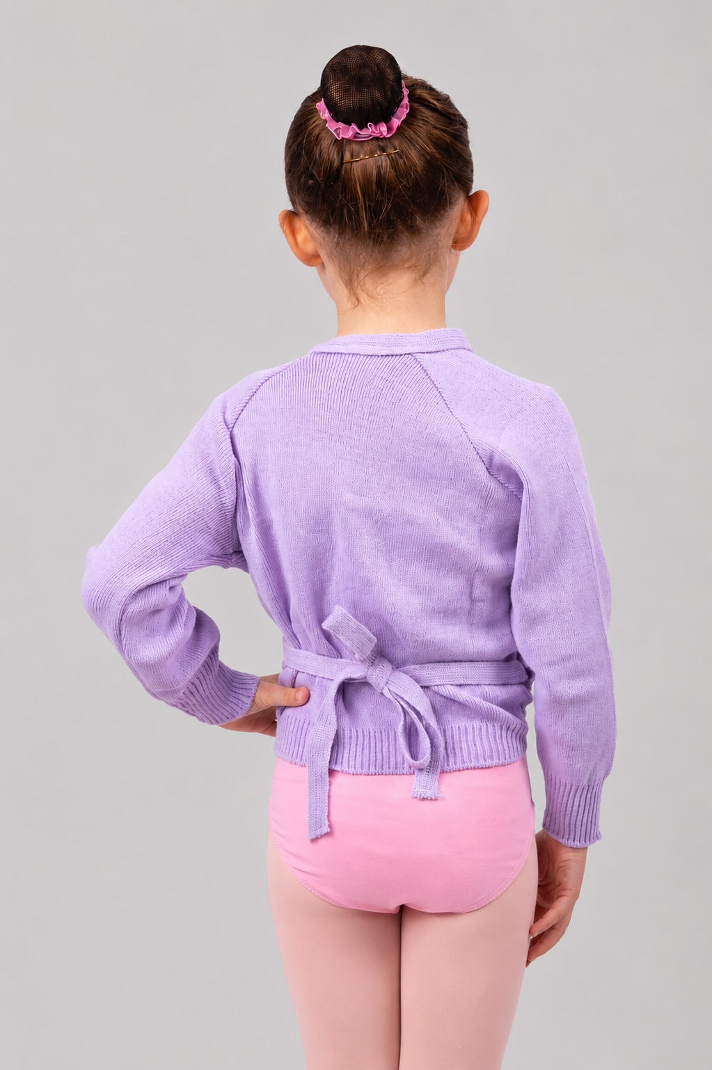 Girl wearing lilac Pulsara ballet wrap cardigan – back view.