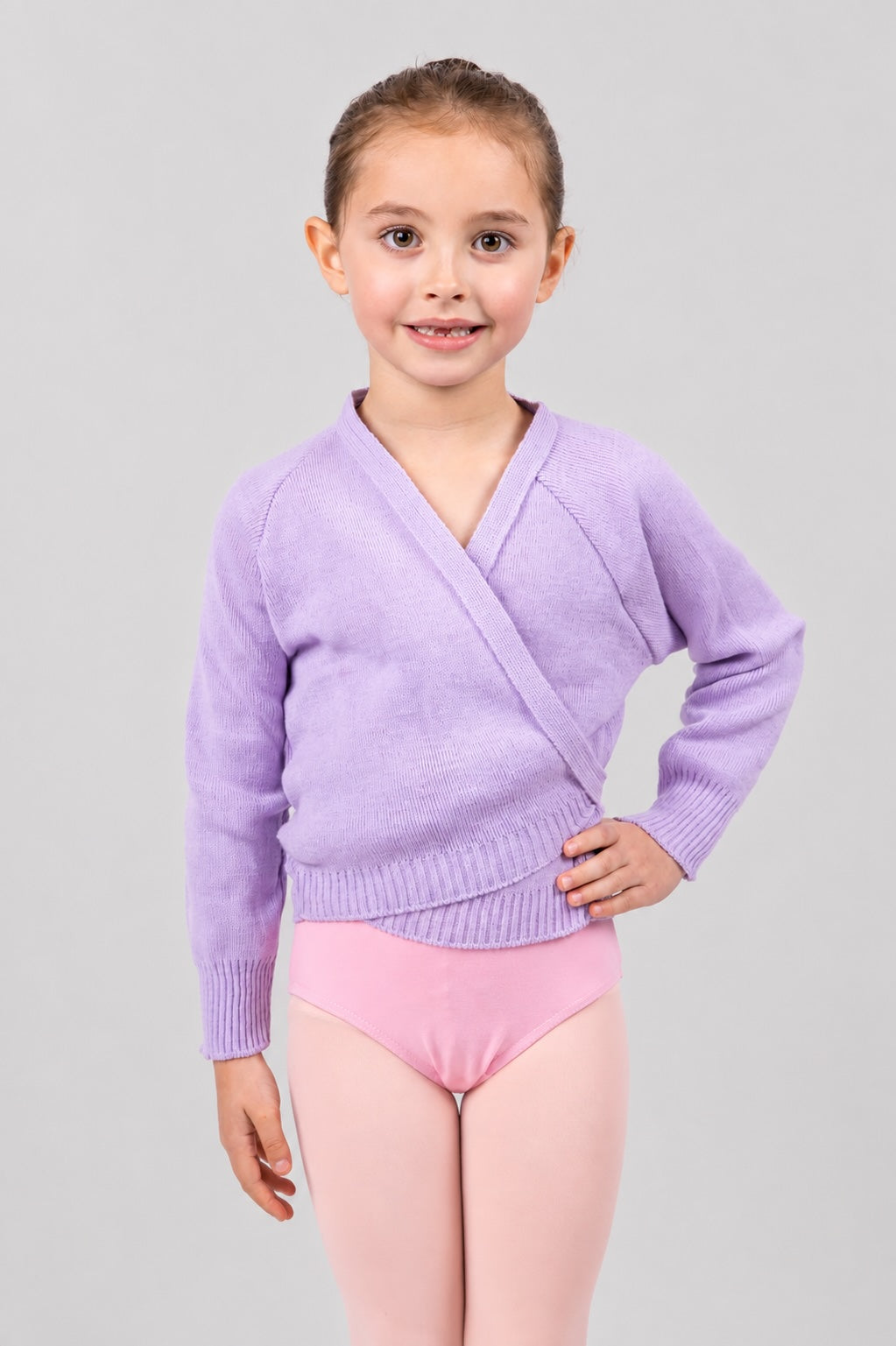 Girl wearing lilac Pulsara ballet wrap cardigan – front view.