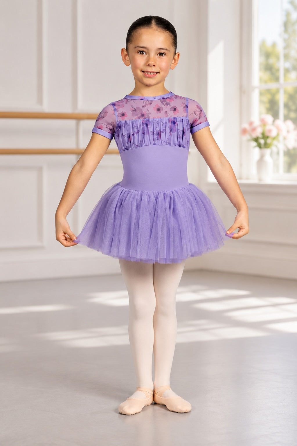 Girl wearing Bloch CL4282 lilac floral ballet tutu dress in a ballet studio