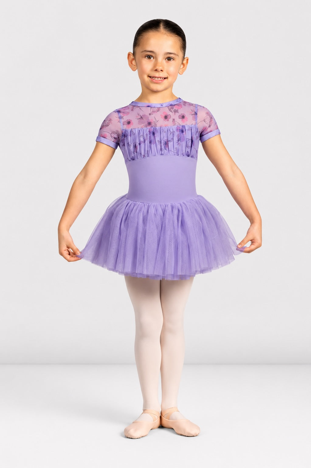 Girl wearing Bloch CL4282 lilac floral ballet tutu dress with layered tulle skirt
