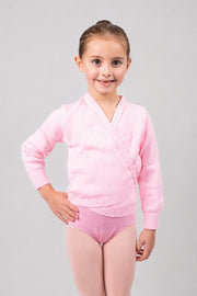 Girl wearing pink Pulsara ballet wrap cardigan – front view.