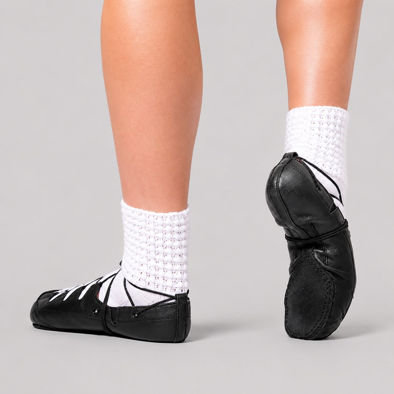 Dancer wearing Hullachan Irish dancing pumps split sole Pro H4 showing side profile and suede sole