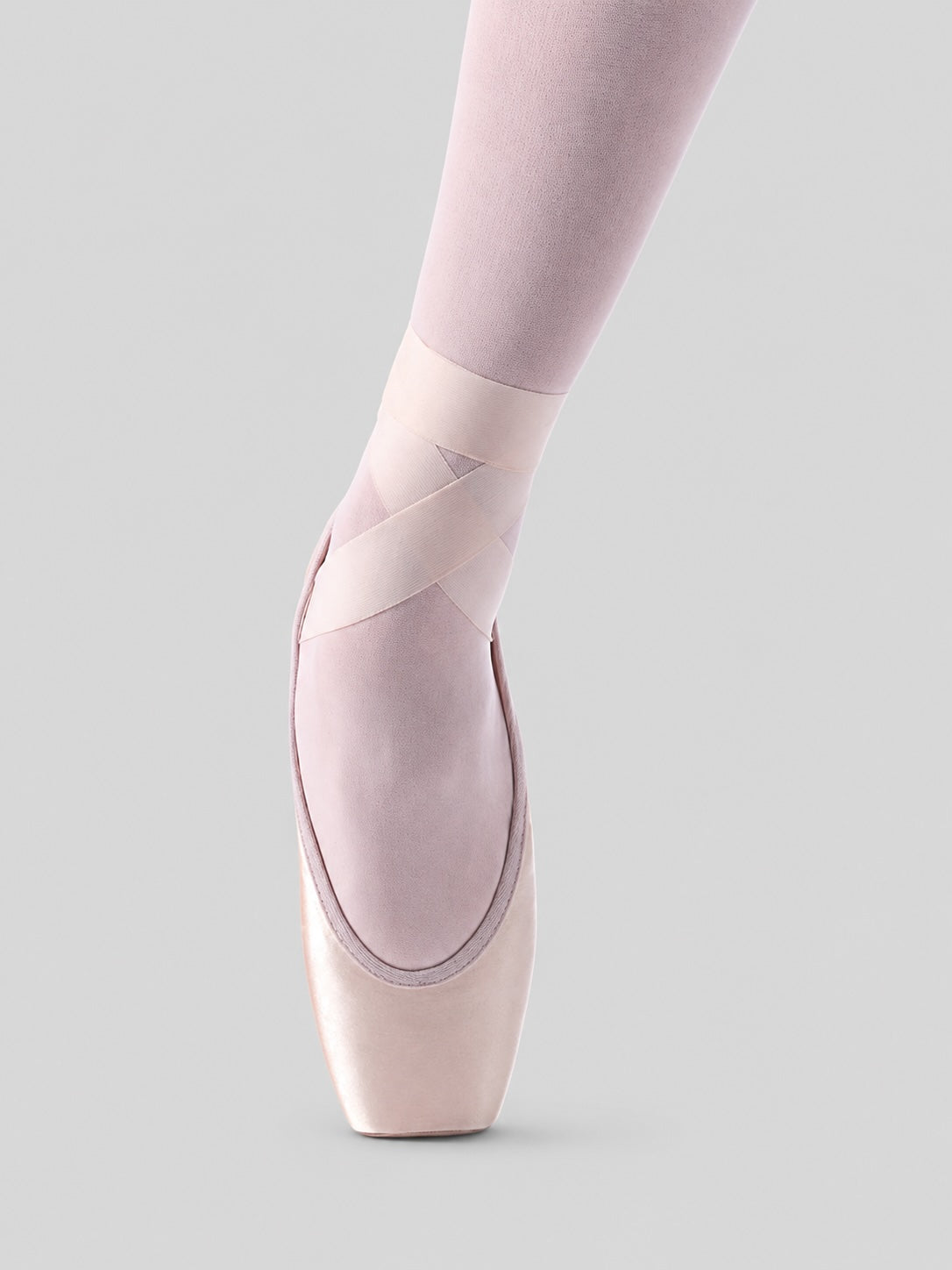 Merlet Belle pointe shoes front view on pointe with light grey background