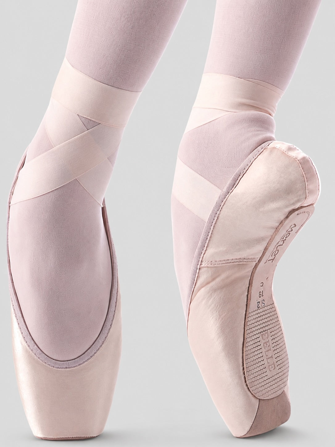 Merlet Belle pointe shoes on pointe with light grey background