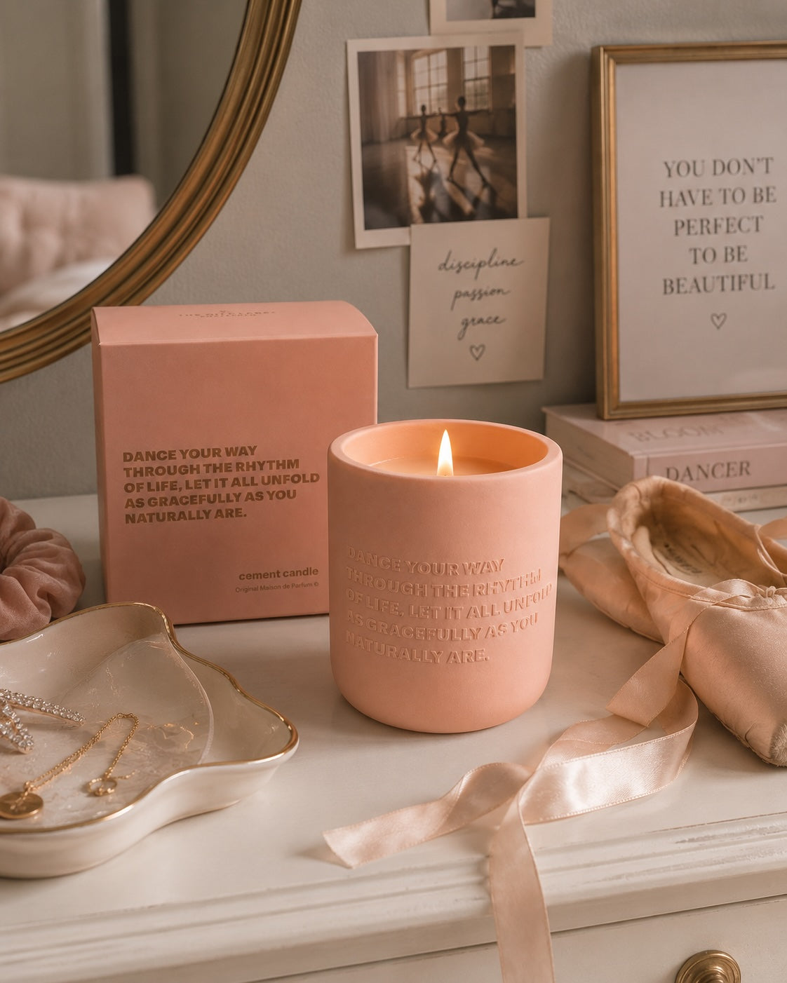 Luxury pink dance candle styled on a dancer’s bedroom vanity with ballet shoes, jewellery and soft warm lighting.