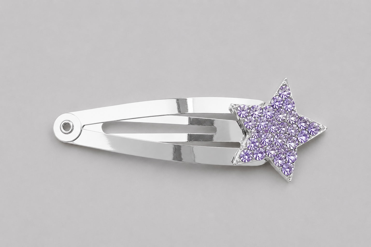 Pink sparkly star hair clip with gold clip detail on a light grey background by Molly & Ro