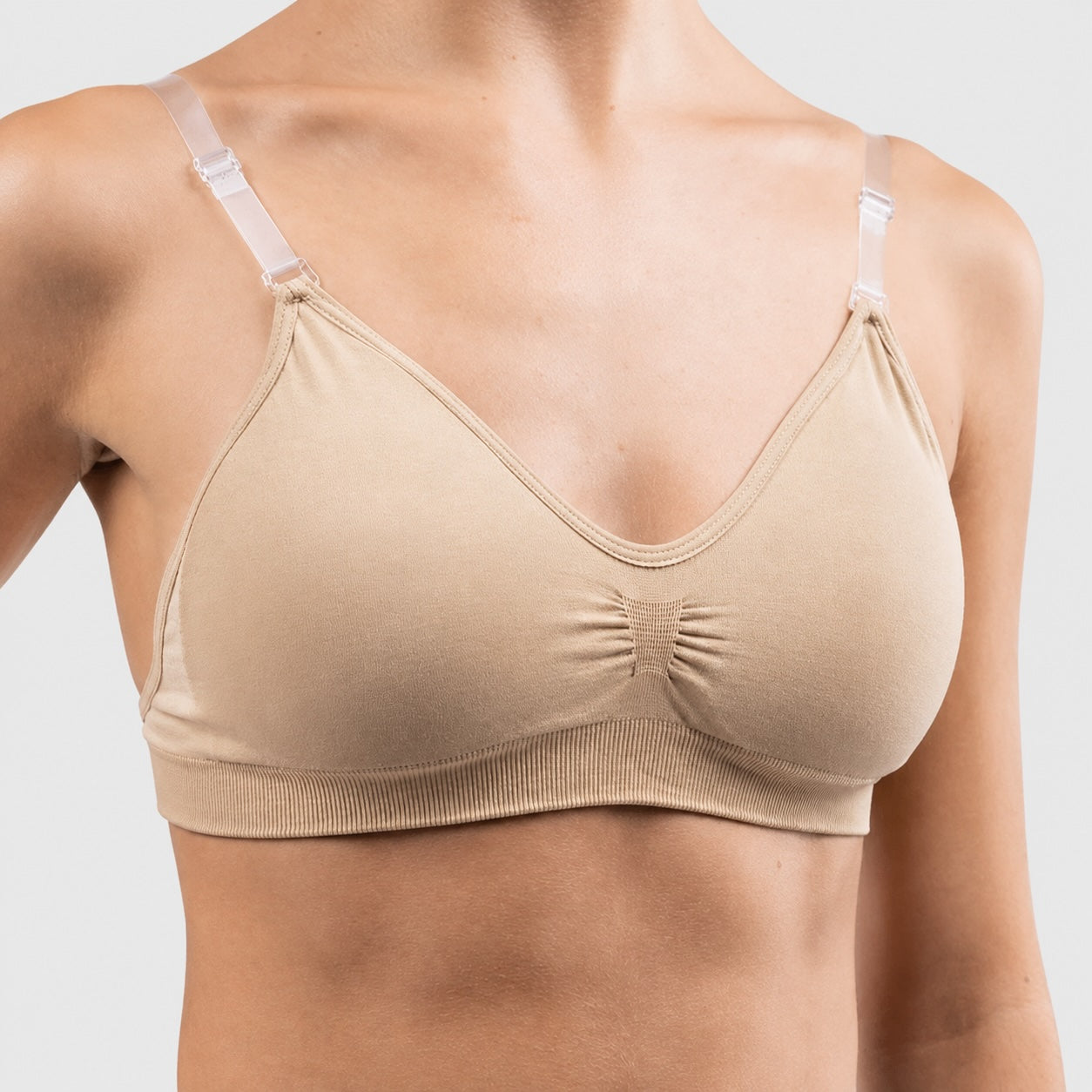 Close-up of Silky Dance seamless clear back dance bra in nude with adjustable clear straps and seamless supportive fit