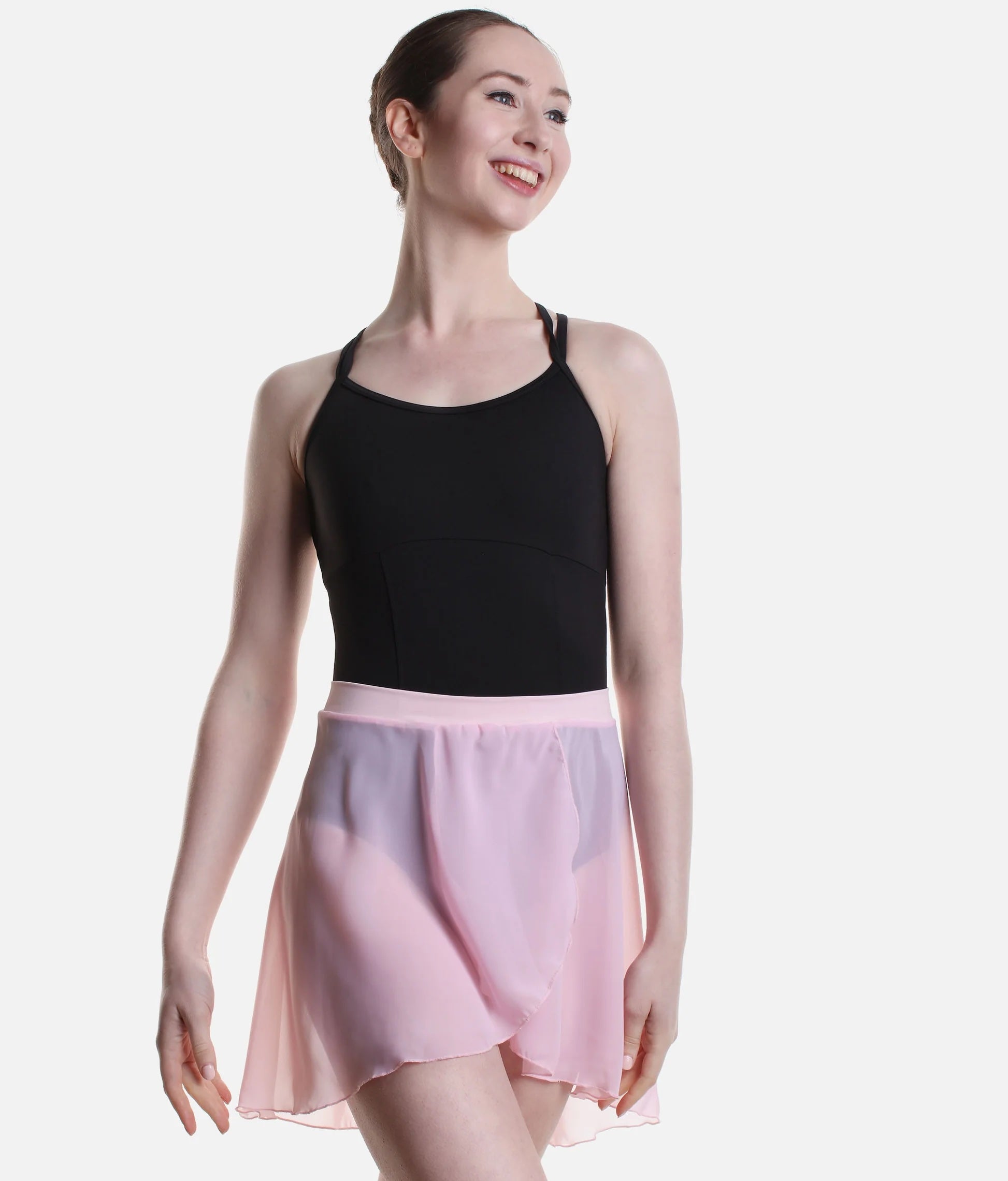 Dancer wearing light pink So Danca SL93 pull-on faux wrap ballet skirt front pose