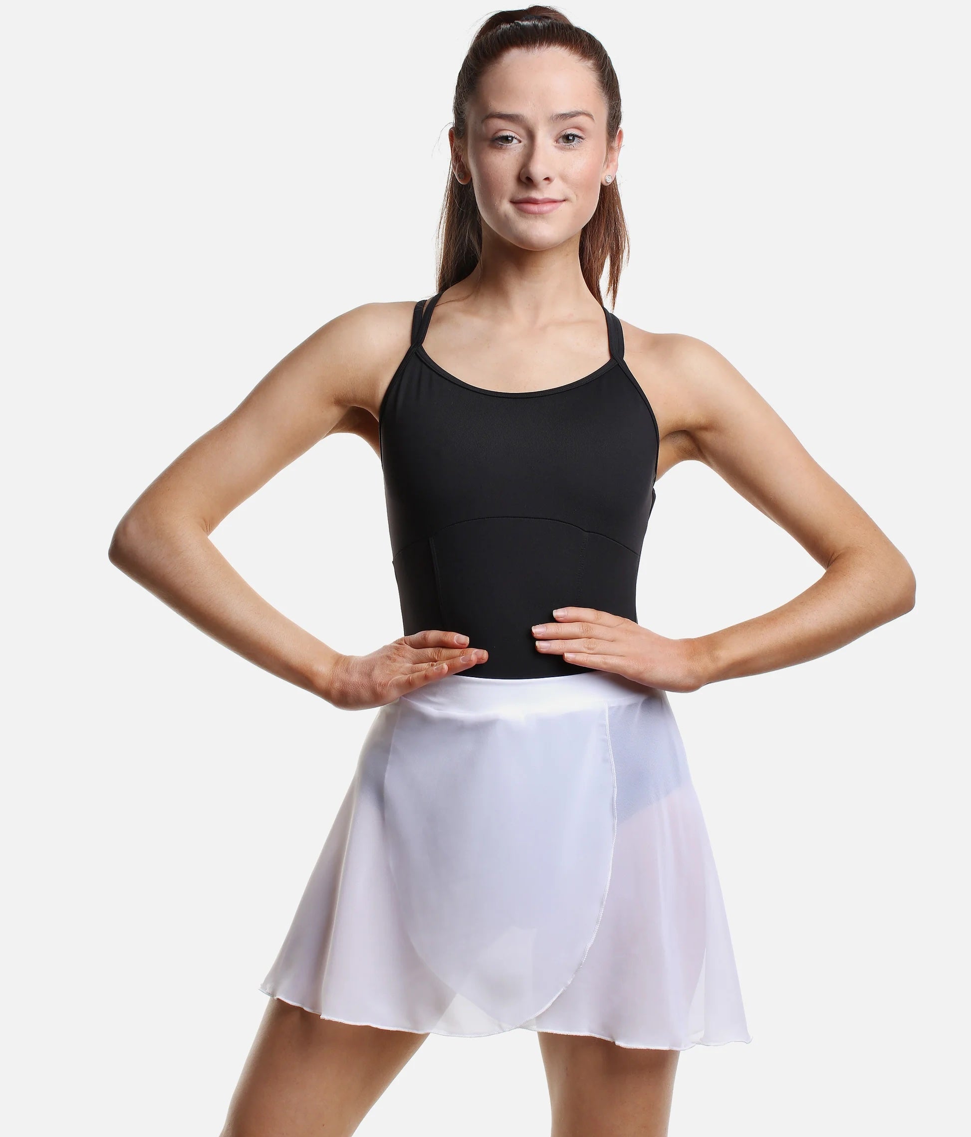 Dancer wearing white So Danca SL93 pull-on faux wrap ballet skirt front pose