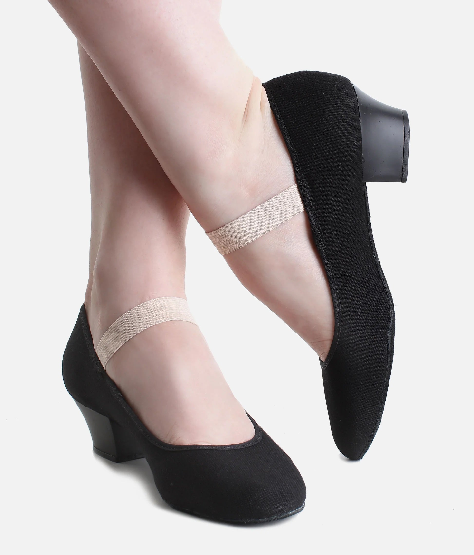 Side view of dancer wearing So Danca RO14 black canvas Cuban heel character shoes