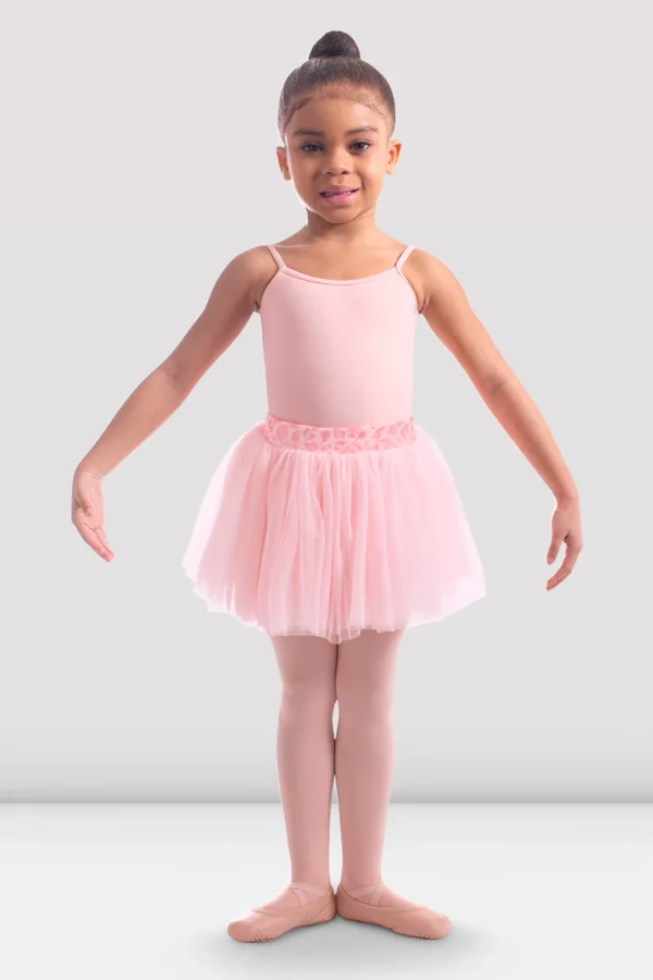 a young girl in a pink tutu ballet ballerina bloch skirt