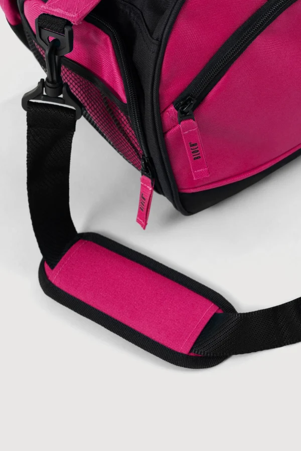 Hand-held straps make for an easy-to-carry bag with the option of an adjustable long strap for cross-body wear. Two separate internal shoe catchments are what make this bag ideal for the dancer who does it all, keeping your shoes separate and easily accessible. Detailed with an exterior drink bottle compartment, mobile phone attachment, and interior and exterior zipper sections with pockets. Fuschia Pink colour