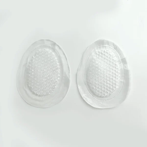 "Close-up of adhesive base and massage dots on So Jelly insoles" "Textured silicone insole grips for anti-slip comfort" "Breathable, reusable silicone pads for foot support and comfort"